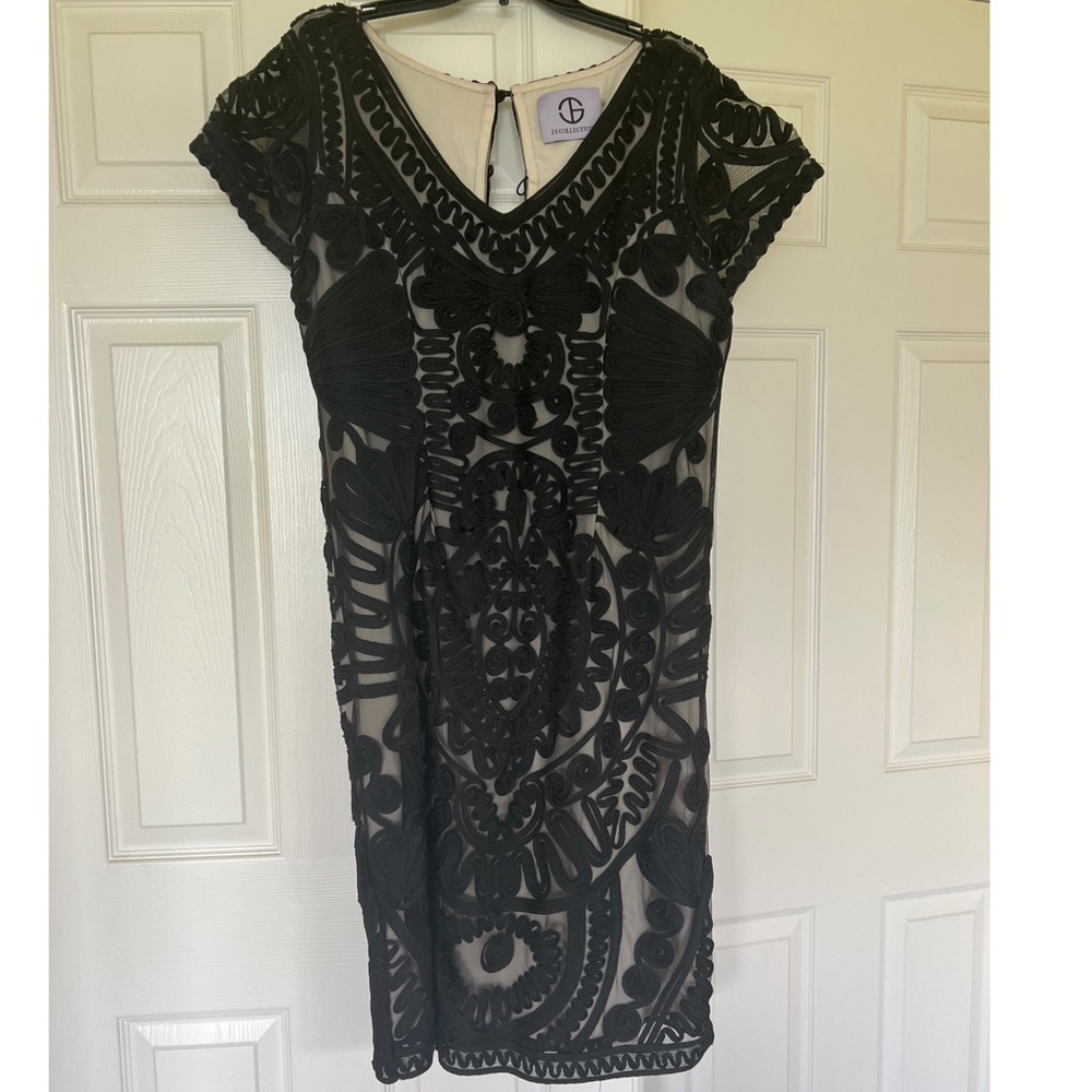 Beautiful design dress. Black and tan colored.
